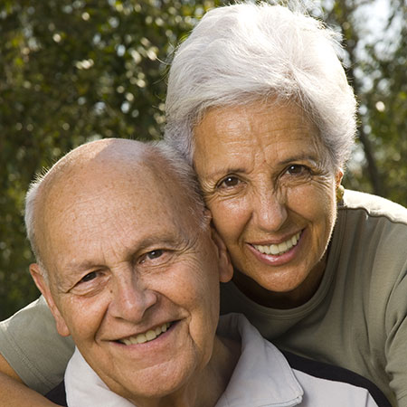 two smiling elderly people